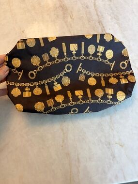 Brown Cosmetic Pouch with Gold Chain & Charm Print- estee laudder